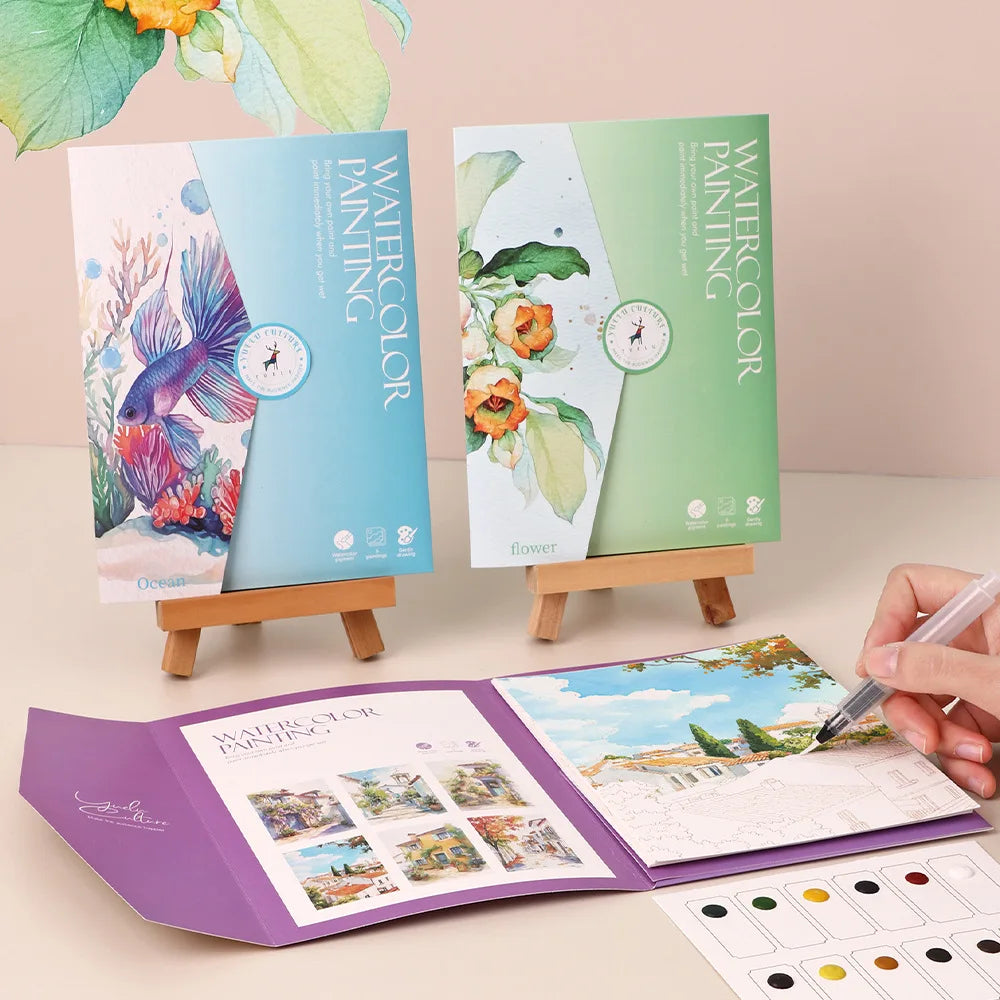 Set creativo di acquerelli con carta, penna immersione e pigmenti
