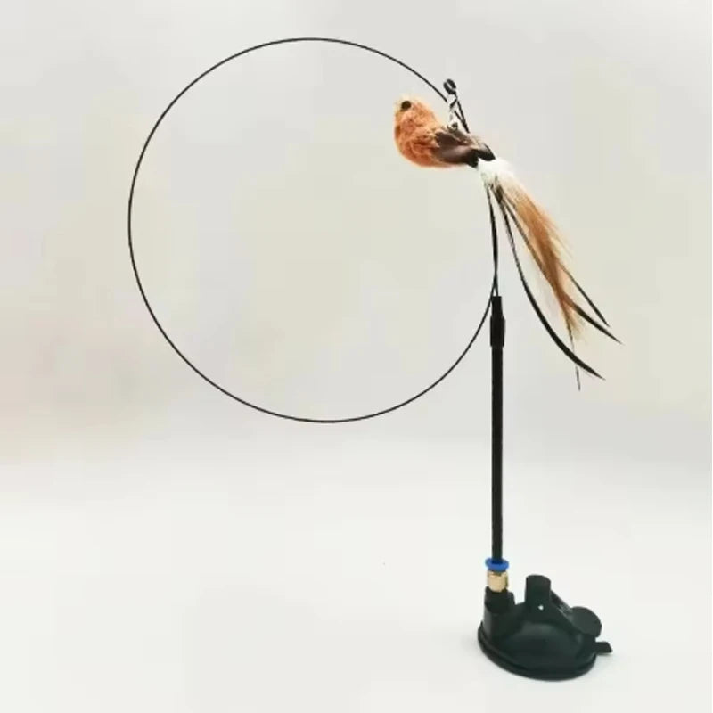 Gioco per gatti con piume, campanella e ventosa - bastoncino resistente al morso